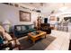 Cozy living room featuring comfortable seating and neutral decor, perfect for relaxing and entertaining at 10910 Rushwood Way, Clermont, FL 34714