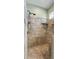 Bathroom walk-in stone shower with glass block accents at 12047 Montevista Rd, Clermont, FL 34711