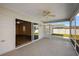 This screened lanai is accessible through sliding glass doors, offering an indoor-outdoor living space at 12050 Ne 51St Cir, Oxford, FL 34484