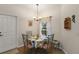 Charming dining area featuring a window, chandelier and comfortable seating at 125 Twin Lake Cir, Umatilla, FL 32784