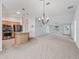 Bright, open layout showcasing the living room, dining area, and kitchen, all bathed in natural light at 1414 Georgetown Ave, The Villages, FL 32162