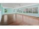 Bright and airy living room with hardwood floors and large windows offer natural light at 1414 Georgetown Ave, The Villages, FL 32162