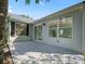 Outdoor patio area with sliding glass door offers a comfortable space for relaxing and entertaining at 1414 Georgetown Ave, The Villages, FL 32162