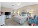 Comfortable main bedroom featuring a ceiling fan and a light-filled space at 1523 W Schwartz Blvd, Lady Lake, FL 32159