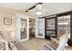 Enclosed lanai featuring tile floors, ceiling fan, and outdoor access at 1523 W Schwartz Blvd, The Villages, FL 32159