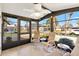Bright sunroom with tile flooring and large windows, perfect for enjoying the outdoors at 1523 W Schwartz Blvd, The Villages, FL 32159