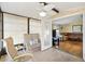Inviting sunroom with tile floors, ceiling fan, and door leading to the living room at 1523 W Schwartz Blvd, The Villages, FL 32159