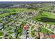 Neighborhood aerial view featuring golf course, lakes and lush landscaping creating a picturesque and desirable community at 17504 Se 119Th Cir, Summerfield, FL 34491