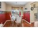 Eat-in kitchen nook features bright lighting, glass table set, and a window with a view at 17504 Se 119Th Cir, Summerfield, FL 34491