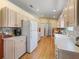 Spacious kitchen boasts tile backsplash, modern appliances, and ample cabinet space at 17504 Se 119Th Cir, Summerfield, FL 34491
