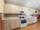 Bright kitchen boasts tile backsplash, ample counter space, and modern appliances at 17504 Se 119Th Cir, Summerfield, FL 34491