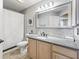 Well-lit bathroom features decorative mirror, modern fixtures, and updated cabinets at 1904 Augustine Dr, The Villages, FL 32159