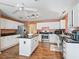 Well-lit kitchen featuring stainless steel appliances, granite countertops, and a center island at 1904 Augustine Dr, The Villages, FL 32159
