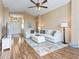Inviting living room with hardwood floors, neutral furniture, and a bright atmosphere at 1904 Augustine Dr, The Villages, FL 32159
