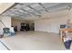 Spacious garage with ample room for parking and storage at 1938 Sassparilla Way, The Villages, FL 32162