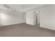 Bright main bedroom with plush carpet, ceiling fan, and convenient access to the closet at 1938 Sassparilla Way, The Villages, FL 32162