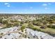 This aerial highlights the property's location in a verdant, well-established neighborhood at 1952 Peachtree Ave, The Villages, FL 32162