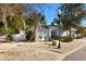 The well-maintained home features manicured landscaping, a stone garden, and a cozy facade at 1952 Peachtree Ave, The Villages, FL 32162