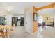 Bright kitchen featuring stainless steel appliances, tile flooring, and a seamless flow into the dining and living areas at 1952 Peachtree Ave, The Villages, FL 32162
