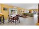 Open-concept layout featuring a dining area and a spacious living room, perfect for entertaining and relaxing at 1952 Peachtree Ave, The Villages, FL 32162
