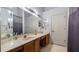 Bathroom with double sinks, ample countertop space, and clean, functional design at 209 Downing Cir, Davenport, FL 33897