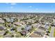 Broad aerial view of the community, showcasing well-maintained homes, streets, and the surrounding green landscape at 2116 Baldwin Run, The Villages, FL 32162