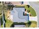 Overhead view of home and the street, showing roof of home and yard at 2116 Baldwin Run, The Villages, FL 32162