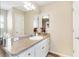 Well-lit bathroom with a vanity, sink and a neutral color palette at 2116 Baldwin Run, The Villages, FL 32162