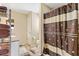 Neutral-toned bathroom with a shower/tub combo and modern vanity with sink at 2116 Baldwin Run, The Villages, FL 32162