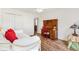 Bedroom featuring wood floors, a desk, a daybed, and ample natural light at 2116 Baldwin Run, The Villages, FL 32162