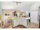 Open layout showcases the kitchen, dining area, and living room at 2116 Baldwin Run, The Villages, FL 32162
