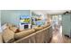 Cozy living room open to the kitchen and dining area, perfect for entertaining at 2116 Baldwin Run, The Villages, FL 32162