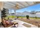 Outdoor patio with furniture and a view of the fenced in backyard at 2116 Baldwin Run, The Villages, FL 32162
