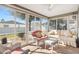 Sunroom featuring tile flooring, ceiling fan and lots of windows and natural light at 2116 Baldwin Run, The Villages, FL 32162