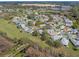 Aerial view of the homes in the community, showcasing the lovely landscaping and highlighted property lines at 21902 King Henry Ave, Leesburg, FL 34748