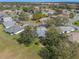 Aerial view of the homes in the community, showcasing the lovely landscaping and mature trees at 21902 King Henry Ave, Leesburg, FL 34748