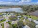 Aerial view of homes in a lakeside community, showcasing the lovely landscaping at 21902 King Henry Ave, Leesburg, FL 34748