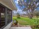 Spacious backyard featuring a lake view and mature landscaping at 21902 King Henry Ave, Leesburg, FL 34748