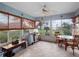 Bright lanai with a ceiling fan, grill and lake views at 21902 King Henry Ave, Leesburg, FL 34748