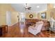 Bright living room with hardwood floors, neutral walls, and comfortable seating, perfect for relaxation at 21902 King Henry Ave, Leesburg, FL 34748