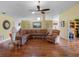 Cozy living room with hardwood floors, comfortable furnishings, and an open layout, perfect for entertaining at 21902 King Henry Ave, Leesburg, FL 34748