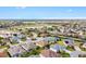 Panoramic aerial view showcasing the residential community and lush green golf course at 2197 Derringer Ave, The Villages, FL 32162