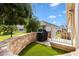 This back patio has a small fenced in area with a grill at 2197 Derringer Ave, The Villages, FL 32162