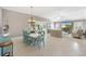 Expansive living room featuring a dining table and ample entertaining space at 2197 Derringer Ave, The Villages, FL 32162