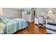 Comfortable main bedroom boasts hardwood floors, a ceiling fan, and a functional built-in desk area at 2197 Derringer Ave, The Villages, FL 32162