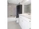 Bathroom featuring tub-shower combination, white vanity and tiled floors at 22325 Sw Nectarine Ln, Dunnellon, FL 34431