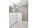 Modern bathroom with tiled walk-in shower, vanity and tiled floor at 22325 Sw Nectarine Ln, Dunnellon, FL 34431