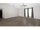 Spacious bedroom featuring new floors, ceiling fan, and ample natural light at 22325 Sw Nectarine Ln, Dunnellon, FL 34431
