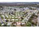 Expansive aerial view of a home in a neighborhood with a view of canals and lakes at 2714 Vindale Rd, Tavares, FL 32778