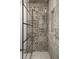 Stunning shower features intricate grey-patterned tile and stylish glass enclosure at 2714 Vindale Rd, Tavares, FL 32778